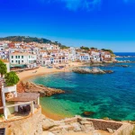 Sea landscape with Calella de Palafrugell, Catalonia, Spain near of Barcelona. Scenic fisherman village with nice sand beach and clear blue water in nice bay. Famous tourist destination in Costa Brava